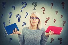 choose-book-confused-student-girl-choosing-two-books-red-blue-left-right-which-one-to-read-difficult-decision-119252584